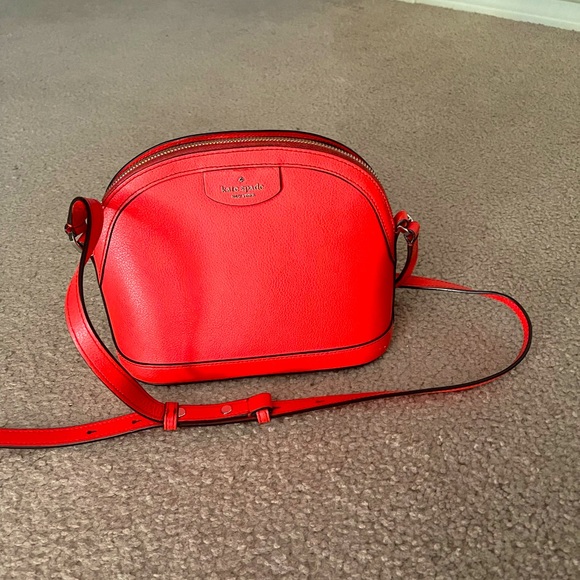 Kate Spade small but spacious red bag easy to carry anywhere